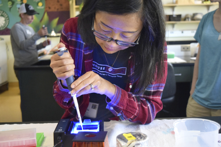 Middle school teacher Estella Tai with pipette