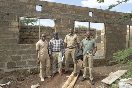Founding LiNK staff in the framing of the building